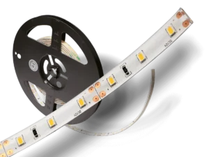 White FlexTape LED strip partially unrolled from a black reel.