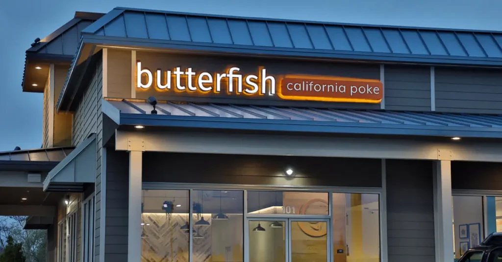 Illuminated Butterfish California Poke storefront sign featured in a Principal Sloan article about color in LED signage.